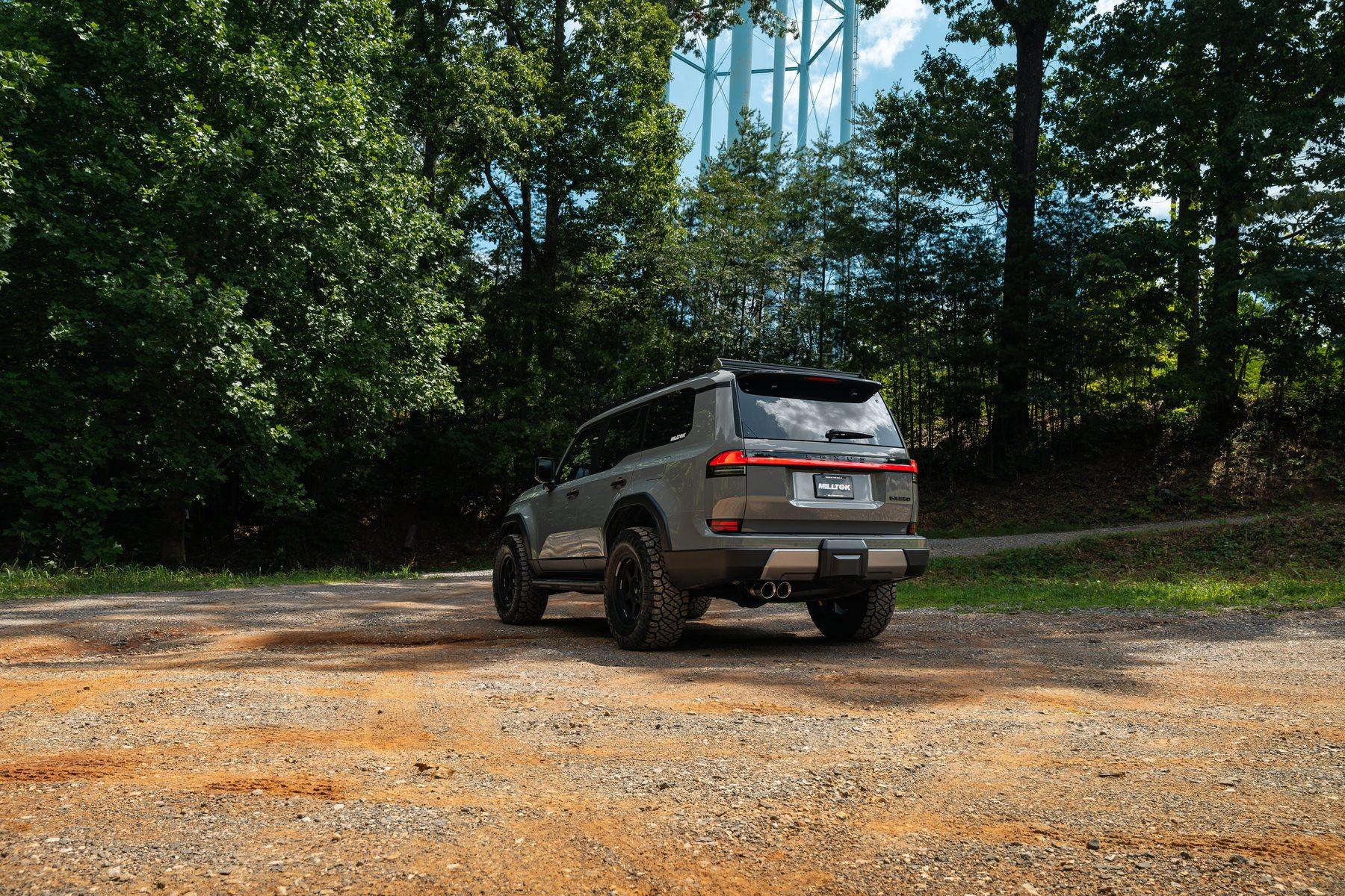 Rear three-quarter view of the Lexus GX 550 with Milltek exhaust on gravel